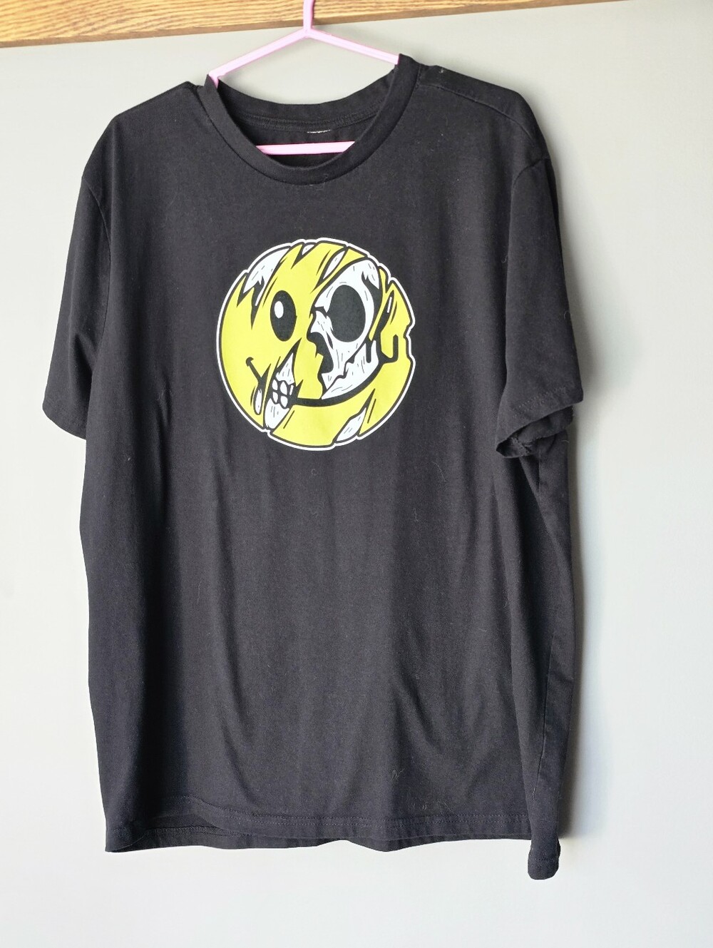 Black Graphic T-Shirt with Yellow Skull Smiley